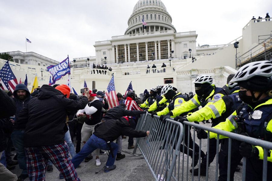 FILE - In this Jan. 6, 2021, file photo, Trump supporters try to break through a police barrier at the Capitol in Washington. For Americas allies and rivals alike, the chaos unfolding during Donald Trumps final days as president is the logical result of four years of global instability brought on by the man who promised to change the way the world viewed the United States. (AP Photo/Julio Cortez, File)