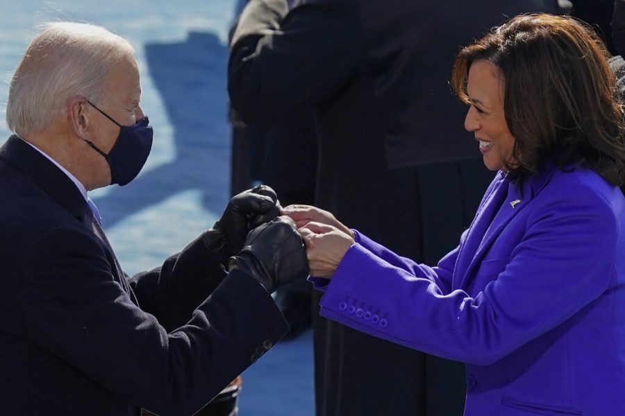 President-elect Joe Biden congratulates Vice President Kamala Harris with a fist bump after she was sworn in during the 59th Presidential Inauguration at the U.S. Capitol in Washington, Wednesday, Jan. 20, 2021. (AP Photo/Carolyn Kaster)