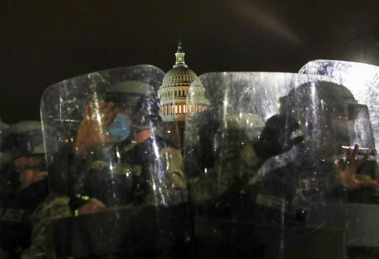Members of the National Guard stand guard outside the Capitol Building, January 6.