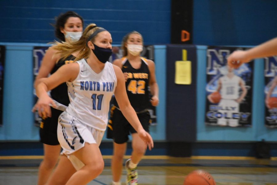 Lindsay dribbles up the court during her senior year to lead the North Penn girls basketball team through this season of COVID.