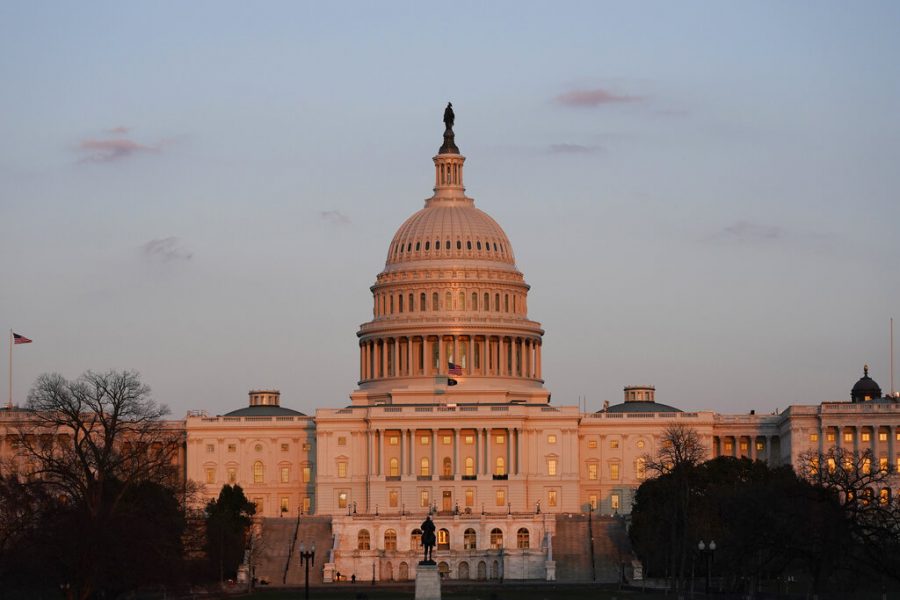 The sun sets on the U.S. Capitol building, Thursday, March 4, 2021, in Washington. (AP Photo/Alex Brandon)