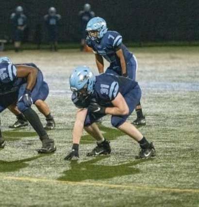 Michael Darcy, 31, gets set for a play during the 2020 football season.