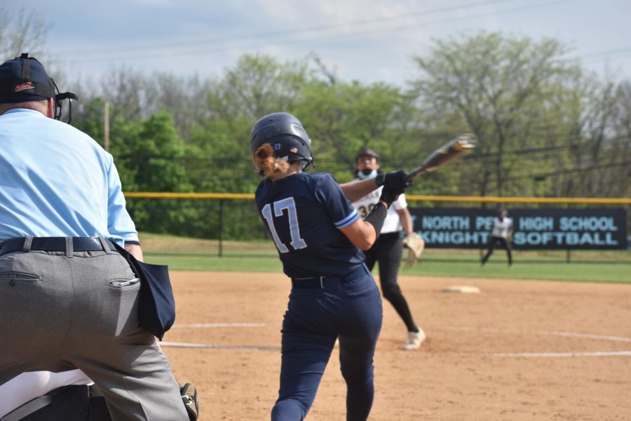 Sophomore Julia Shearer sends the first of her two home runs, over the center field fence in the 1st inning.