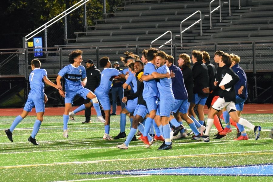 North+Penn+boys+soccer+team+celebrating+their+first+playoff+victory.