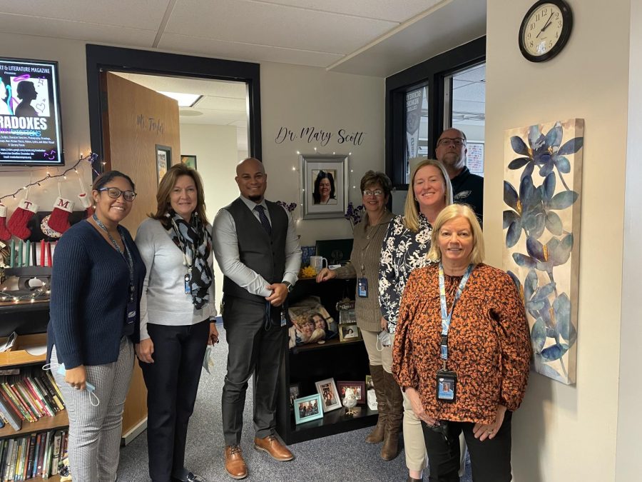 The administrators of K025 posing with late co-worker Dr. Mary Scott. 