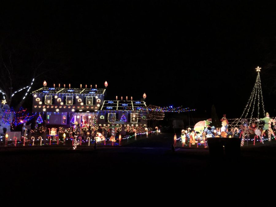 FILE PHOTO: Christmas lights brighten the night on  Saint Andrews Way in Towamencin Twp.  
Although this house is hiding at the top of a cul de sac, you can see its lights from a mile away. The lawn has characters from your favorite Christmas movies, like the Grinch and even a life-sized Santa on the front porch.