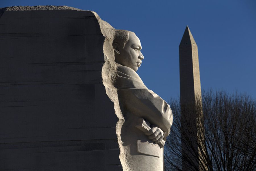 The Martin Luther King, Jr. Memorial is seen with the Washington Monument, during the 9th Annual Wreath Laying and Day of Reflection and Reconciliation, in Washington, Monday, Jan.20, 2020. (AP Photo/Jose Luis Magana)