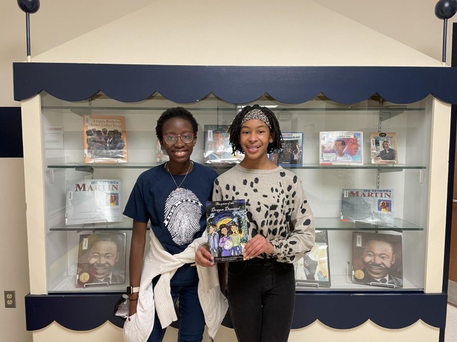 Makayla+Lewis+and+Nokukhanya+Ndlovu+proudly+holding+their+published+book+at+Nash+elementary.