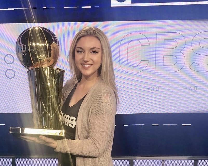 Milliron with the Larry O'Brien Trophy at CBS, her reporting home base.