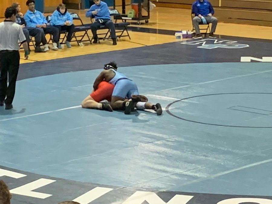 Grappling with Souderton: Amir Rose matches up with a Souderton wrestler on Feb 2, 2022. North Penn suffered a defeat at the hands of the Indians on senior night. 