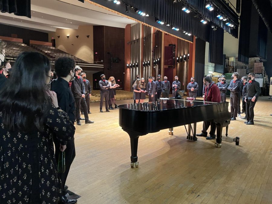 Choir Director Matthew Klenk and the choir practice vocal warm-ups before first period in preparation for the day ahead of them.