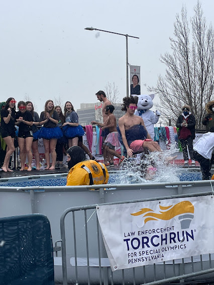 Seth Walton, a NPHS senior, plunges into the icy waters. 