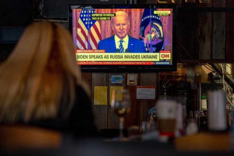 President Joe Biden speaks about Russias invasion of Ukraine on a television at Shaws Tavern in Washington, Thursday, Feb. 24, 2022. (AP Photo/Andrew Harnik)