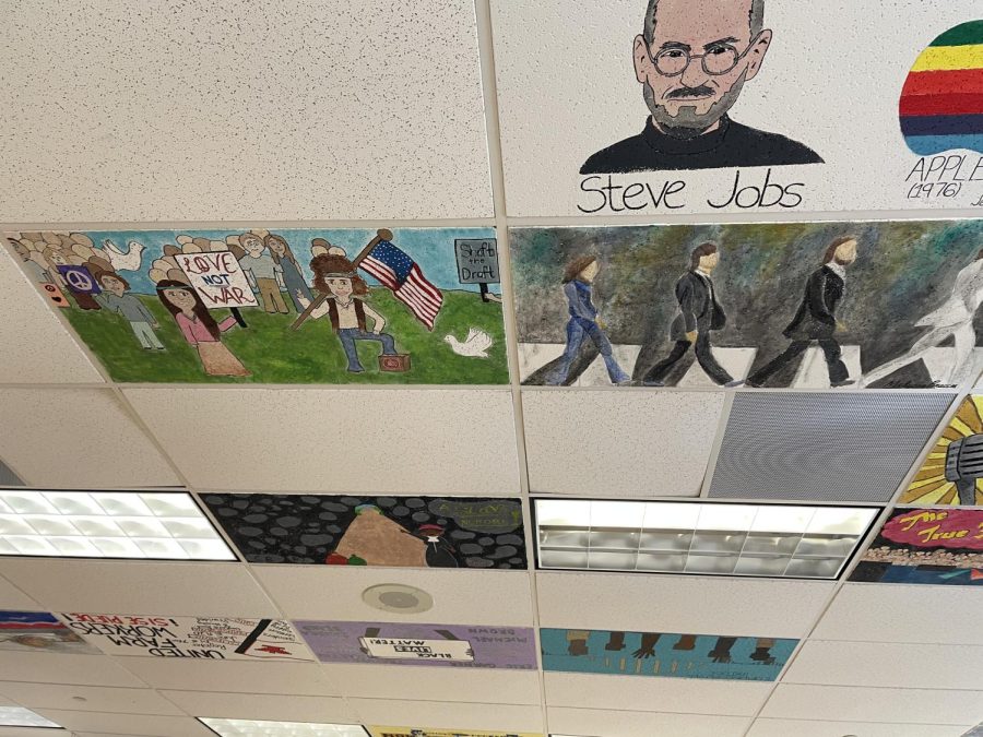 Pictured here is Steve Jobs,  the Abbey Road album cover, and other history inspired ceiling tiles.