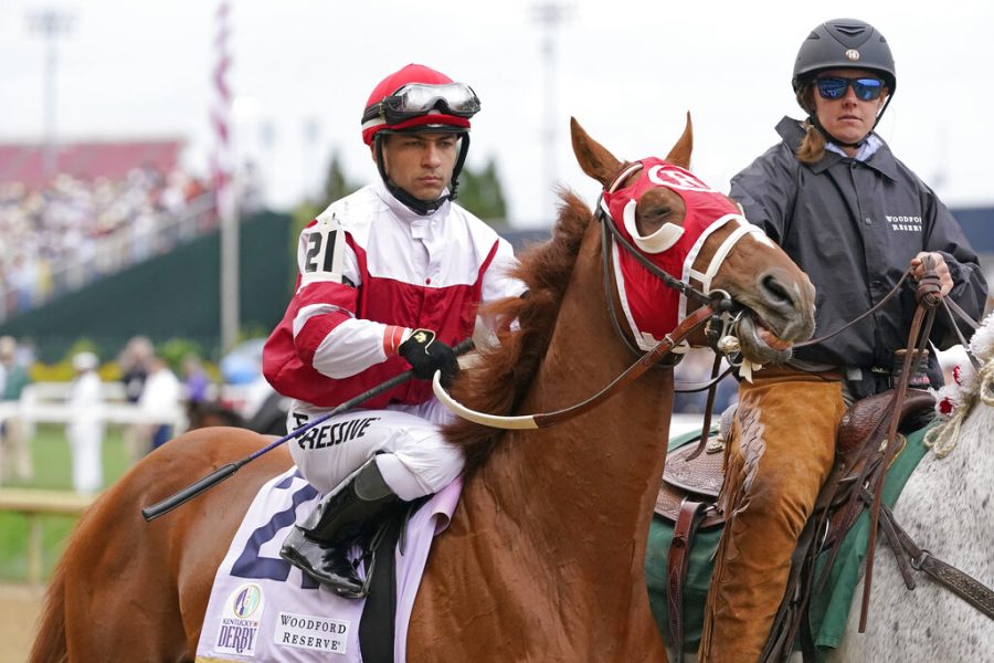 Sonny Leon rides Rich Strike (21) onto the track for the 148th running of the Kentucky Derby horse race at Churchill Downs Saturday, May 7, 2022, in Louisville, Ky. (AP Photo/Mark Humphrey)