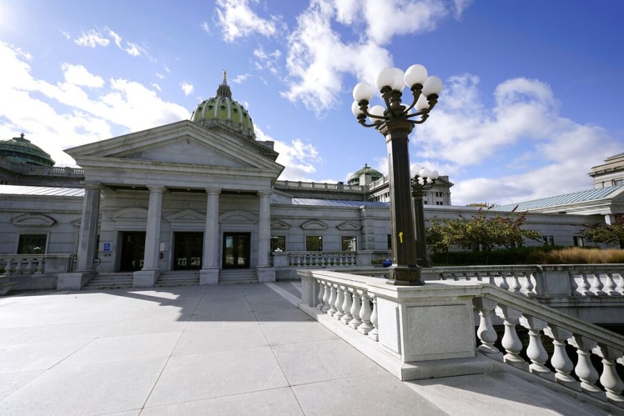 Clouds dot the sky above the Pennsylvania State Capitol, Monday, Nov. 2, 2020, in Harrisburg, Pa. (AP Photo/Julio Cortez)