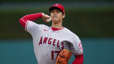 Los Angeles Angels pitcher Shohei Ohtani throws a warmup pitch against the Detroit Tigers in the first inning of a baseball game in Detroit, Sunday, Aug. 21, 2022. (AP Photo/Paul Sancya)