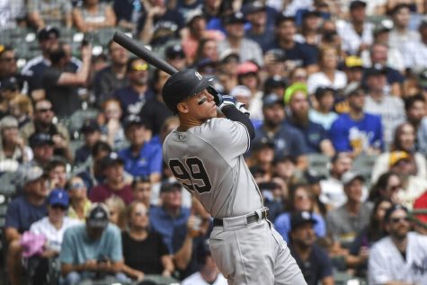 New York Yankees Aaron Judge hits his fifty eighth homerun during the third inning of a baseball game against the Milwaukee Brewers Sunday, Sept. 18, 2022, in Milwaukee. (AP Photo/Kenny Yoo)