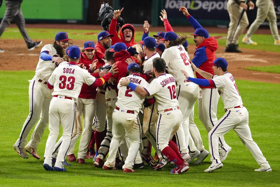 Philadelphia Phillies celebrate after winning the baseball NL Championship Series in Game 5 against the San Diego Padres on Sunday, Oct. 23, 2022, in Philadelphia. (AP Photo/Matt Rourke)