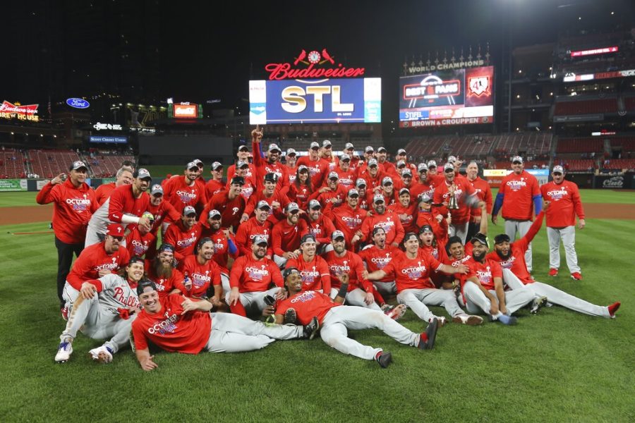 The Philadelphia Phillies celebrate after defeating the St. Louis Cardinals 2-0 in Game 2 of an NL wild-card baseball playoff series Saturday, Oct. 8, 2022, in St. Louis. The Phillies advanced to an NL Division Series against the Atlanta Braves. (AP Photo/Scott Kane)