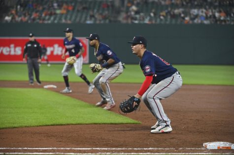 Minnesota Twins first baseman Jose Miranda, second baseman Luis Arraez and shortstop Carlos Correa (4) stand in a defensive shift during the fourth inning of a baseball game against the Baltimore Orioles , Wednesday, May 4, 2022, in Baltimore. (AP Photo/Tommy Gilligan)