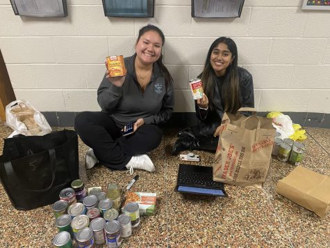 HELPING HANDS- Vice Presidents Sacchi Sainnath and Michelle Schwartz counting cans for Thespian Troupe #5464s Trick or Treat so Tots can Eat.
