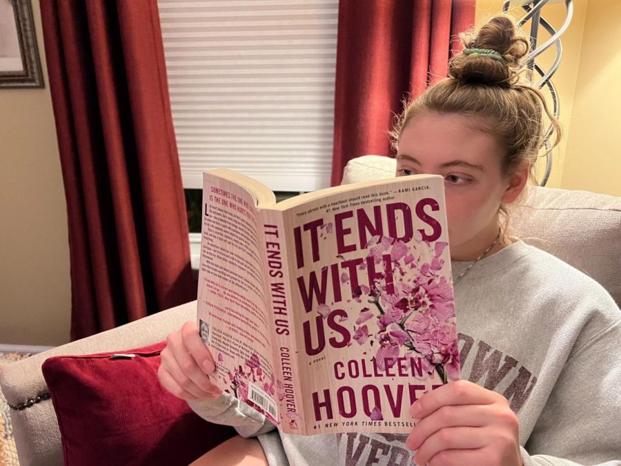 Teenage girl immersed into Colleen Hoover’s best-selling novel, It Ends With Us.