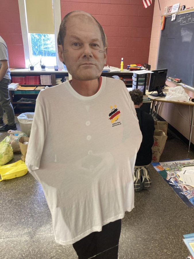 A JOLLY STANDEE - An ersatz Olaf Scholz, the chancellor of Germany, stands in the German club’s shirt.