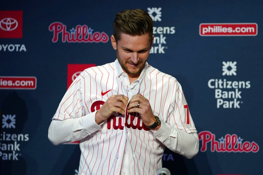 Newly+acquired+Philadelphia+Phillies+shortstop+Trea+Turner+puts+on+a+jersey+during+his+introductory+news+conference%2C+Thursday%2C+Dec.+8%2C+2022%2C+in+Philadelphia.+%28AP+Photo%2FMatt+Slocum%29