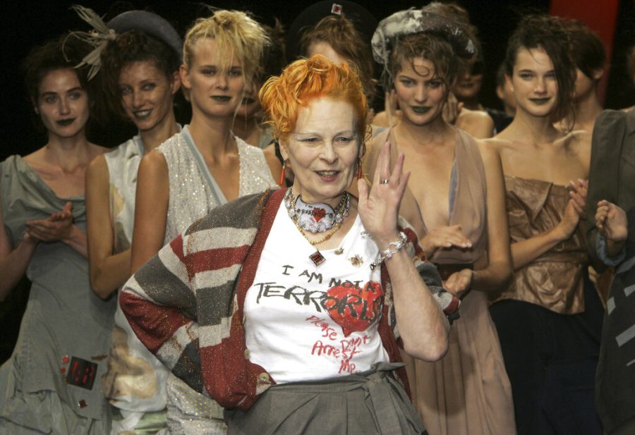 FILE - Models applaud as British fashion designer Vivienne Westwood salutes the public after the presentation of her Spring/Summer 2006 collection in Paris, Tuesday, Oct. 4, 2005. Westwood, an influential fashion maverick who played a key role in the punk movement, died Thursday, Dec. 29, 2022, at 81. (AP Photo/Michel Euler, File)