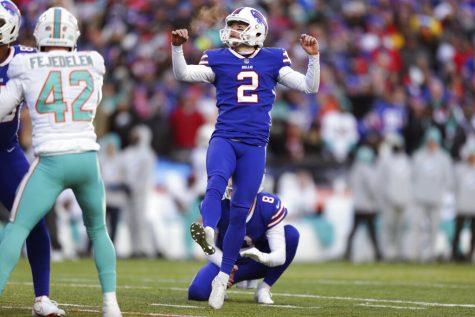 Buffalo Bills Tyler Bass (2) watches his extra point during the second half of an NFL wild-card playoff football game against the Miami Dolphins, Sunday, Jan. 15, 2023, in Orchard Park, N.Y. (AP Photo/Joshua Bessex)