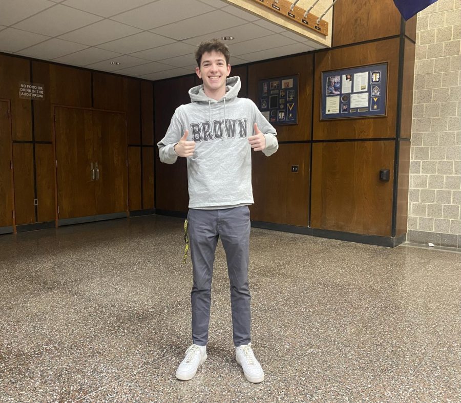 Jack+Bachman+poses+wearing+his+new+Brown+University+merch.