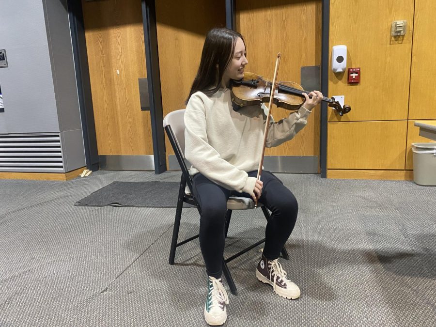 Hailey Swyter practicing her violin after school.