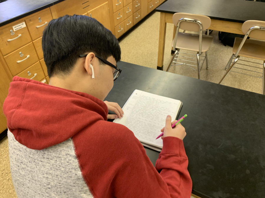NPHS student Cody Luong reviews notes for an upcoming exam. 