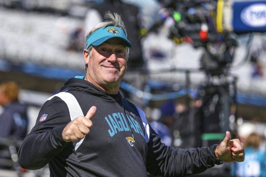 FILE+-+Jacksonville+Jaguars+coach+Doug+Pederson+walks+onto+the+field+for+warmups+for+the+teams+NFL+football+game+against+the+Dallas+Cowboys%2C+Dec.+18%2C+2022%2C+in+Jacksonville%2C+Fla.+Brian+Daboll%2C+Pederson+and+Kyle+Shanahan+are+the+finalists+for+AP+Coach+of+the+Year+award.+%28AP+Photo%2FGary+McCullough%2C+File%29