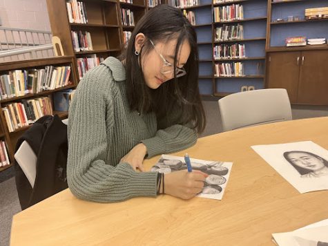 Hannah Kim using her artistic talents. Kim’s current artworks are centered around realism.