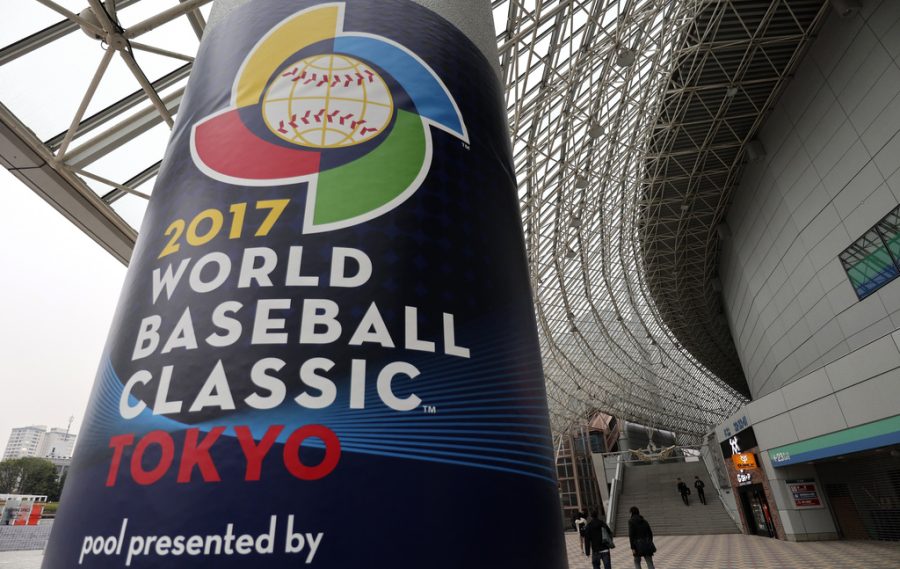People walk around Tokyo Dome in Tokyo, Monday, March 6, 2017. The Group B first round games played by Australia, China, Cuba and Japan will start on Tuesday at the indoor stadium. (AP Photo/Shizuo Kambayashi)
