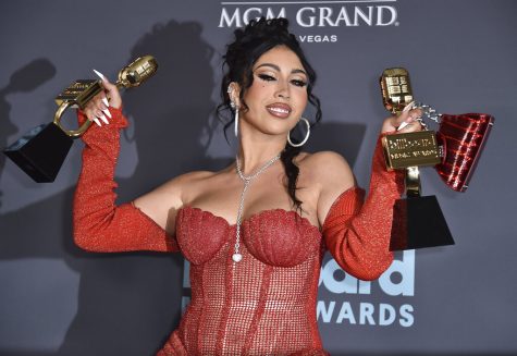 Kali Uchis poses in the press room with the awards for Top Latin Artist and Top Latin Female Artist at the Billboard Music Awards on Sunday, May 15, 2022, at the MGM Grand Garden Arena in Las Vegas. 