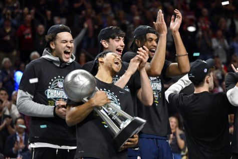 Gonzaga guard Rasir Bolton, second left, celebrates with the championship trophy after the team defeated Saint Marys in an NCAA college basketball game in the finals of the West Coast Conference mens tournament Tuesday, March 7, 2023, in Las Vegas. 