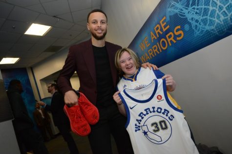 Grace can’t contain her excitement as she poses for a photo with her idol Steph Curry.
