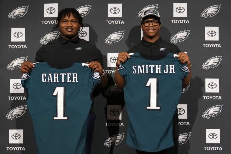 Newly drafted Philadelphia Eagles Jalen Carter, left, and Nolan Smith pose for a photo after a news conference at the NFL football teams training facility, Friday, April 28, 2023, in Philadelphia. (AP Photo/Matt Slocum)