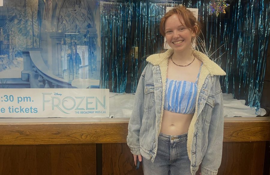 Nora Eliff shows her love in front of the auditorium doors where she puts on a performance to close out her high school career.
