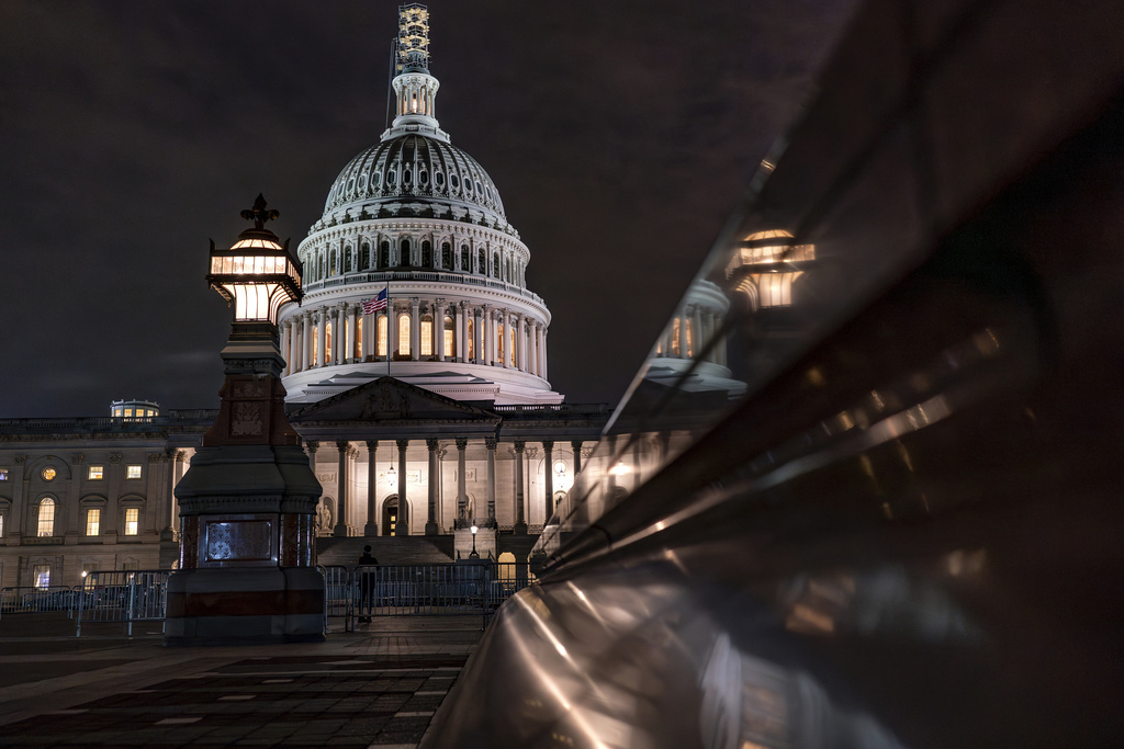 The Capitol is seen late Tuesday night, Sept. 26, 2023, in Washington, as lawmakers work to advance appropriations bills on the House floor. The Republican-controlled House and the Democrat-controlled Senate are starkly divided over very different paths to preventing a federal shutdown. (AP Photo/J. Scott Applewhite)