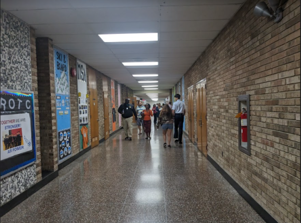 Parents and students stroll through the hallways of North Penn High School during back to school night.