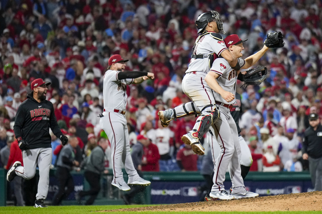 The Arizona Diamondbacks celebrate their win against the Philadelphia Phillies in Game 7 of the baseball NL Championship Series in Philadelphia Wednesday, Oct. 25, 2023. (AP Photo/Matt Slocum)