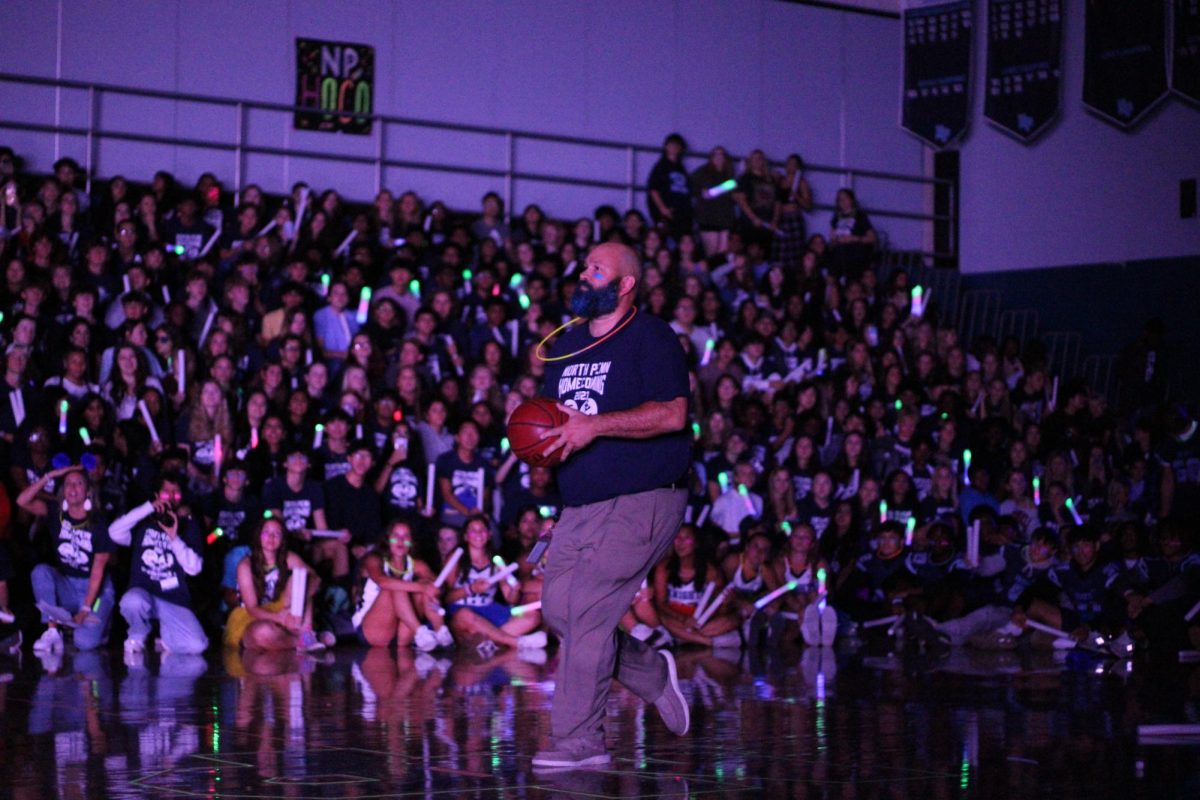 North Penn High School Principal Mr. Kyle Hassler taking the half-court shot.