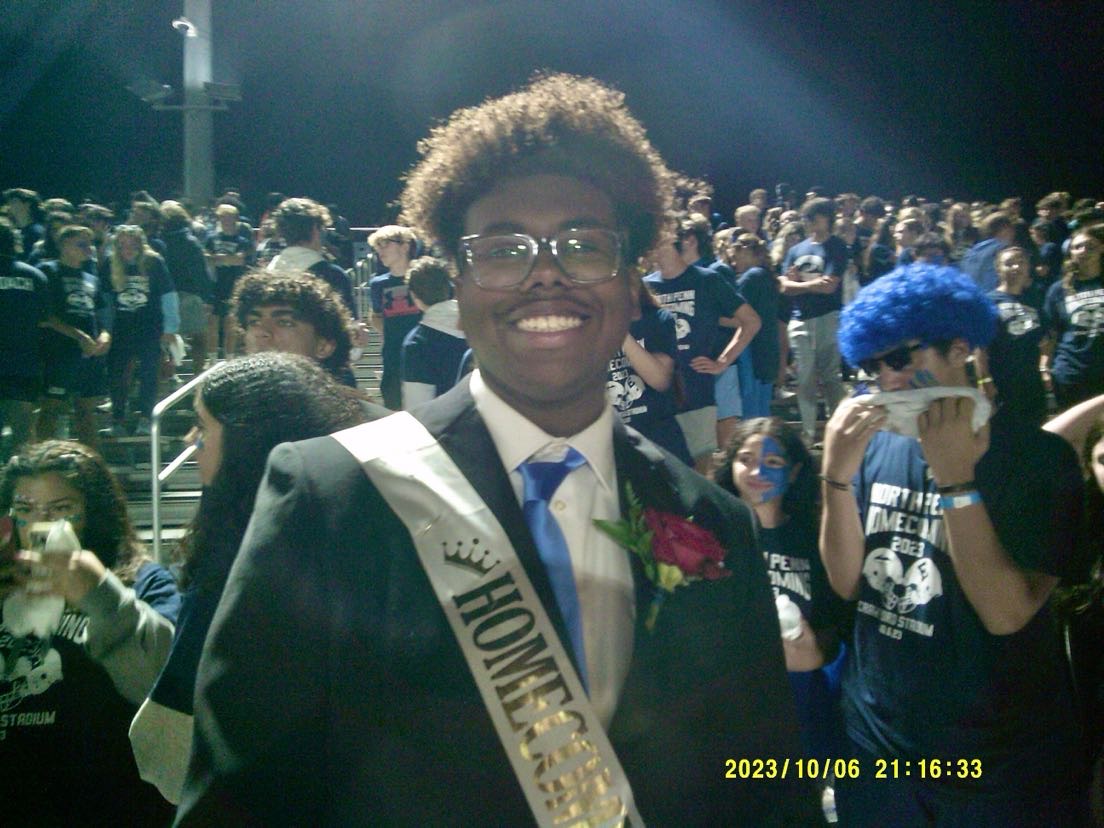 Avery Browns infectious smile brightens the student section during the homecoming game.