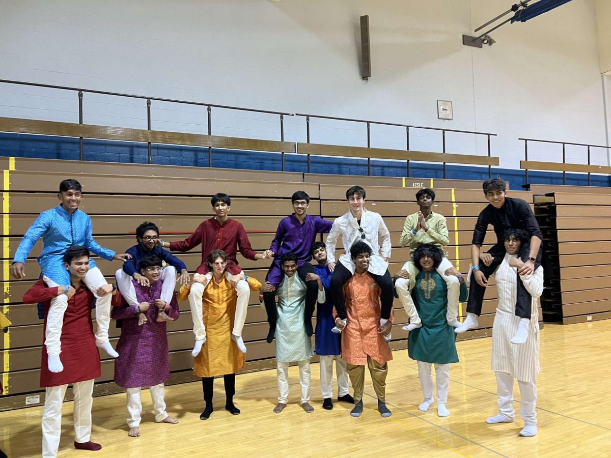 Picture from Garba night of boys in a traditional Indian clothing, a Kurta.