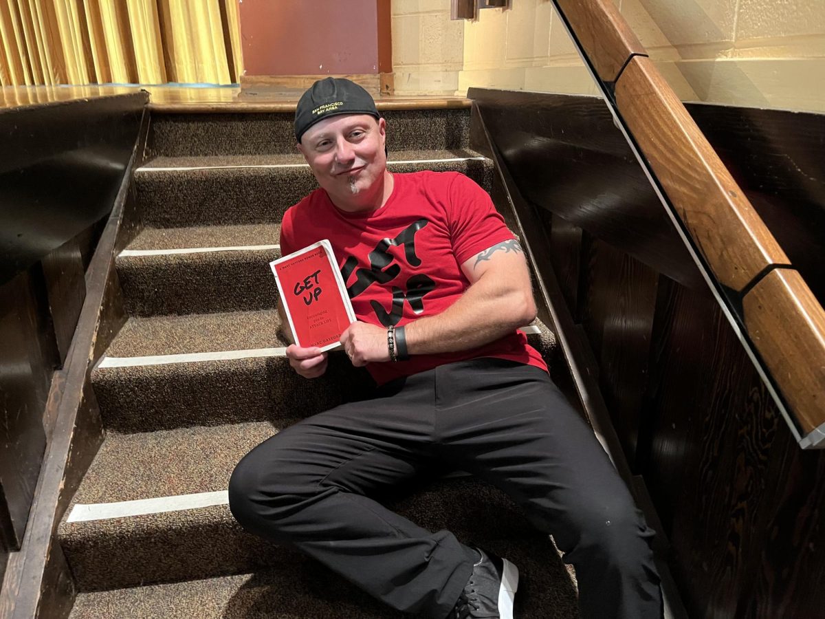 Marc Hayford holds up his best-selling book, “Get Up.”