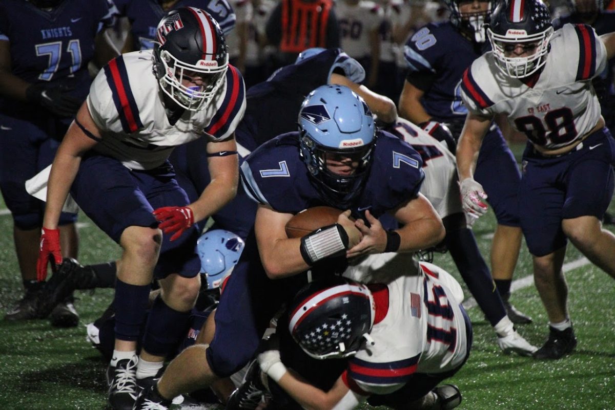 North Penns Aidan Eves is brought down by a gang of CB East defenders during the Knights 14-7 win on Friday, October 6, 2023. 